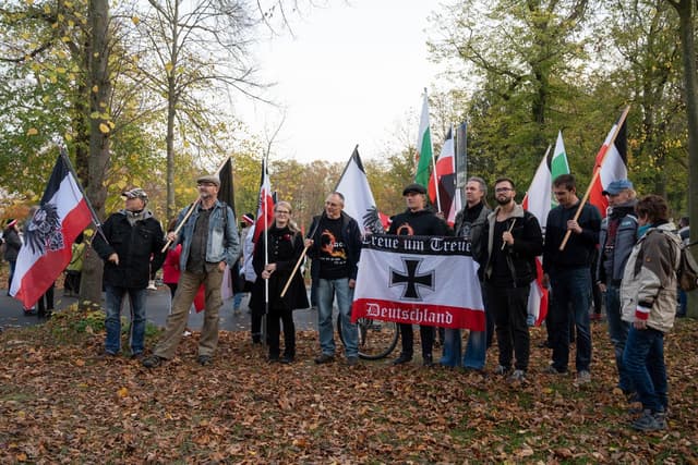 Germany bans the largest 'Reich citizen' group and raids leaders' homes.